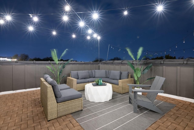 patio at twilight with an outdoor hangout area