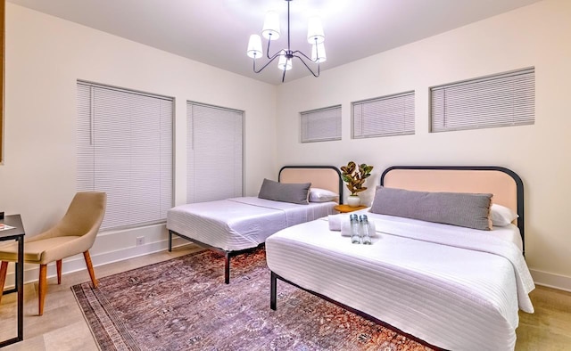 bedroom with a notable chandelier