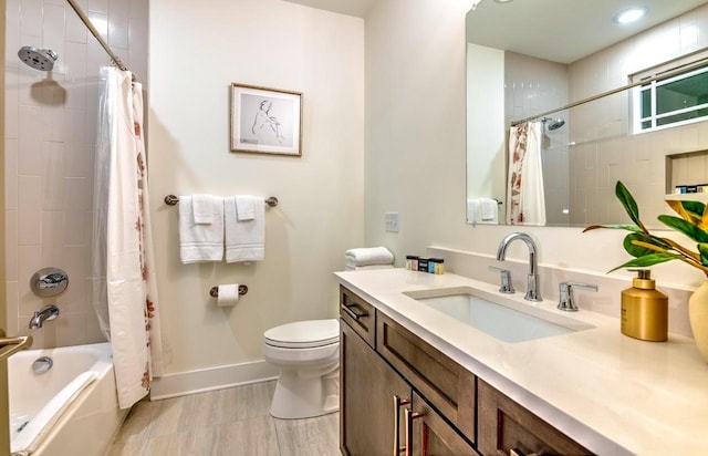 full bathroom with vanity, toilet, and shower / bath combo with shower curtain