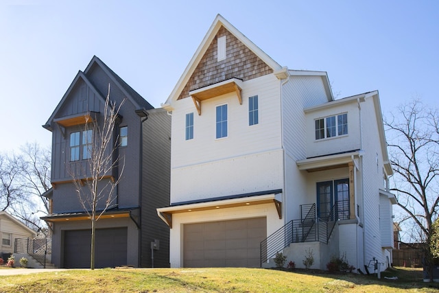 view of front of property with a garage and a front yard