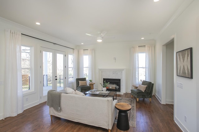 living room with crown molding, dark hardwood / wood-style floors, and french doors