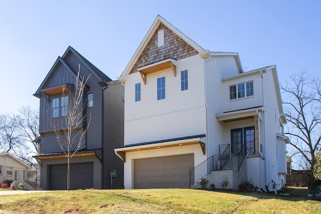 view of front of home featuring a garage and a front yard