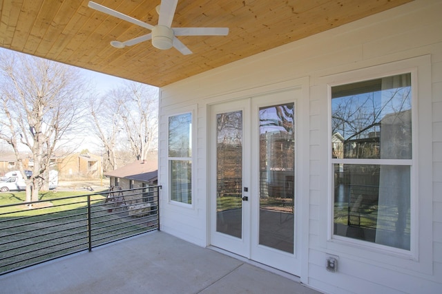 exterior space featuring a balcony and ceiling fan