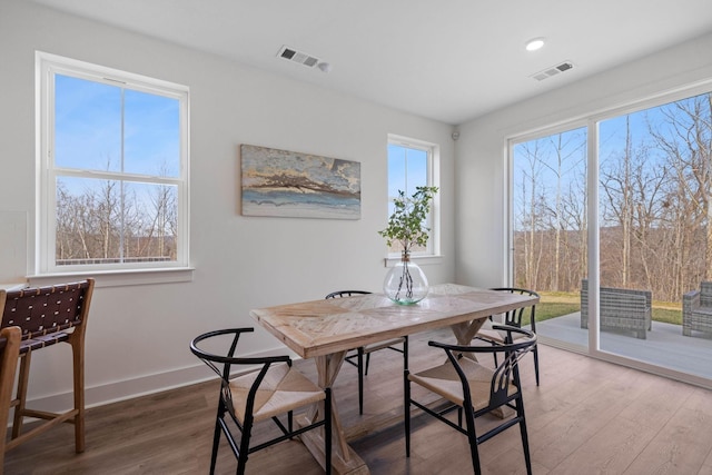 dining area featuring hardwood / wood-style flooring