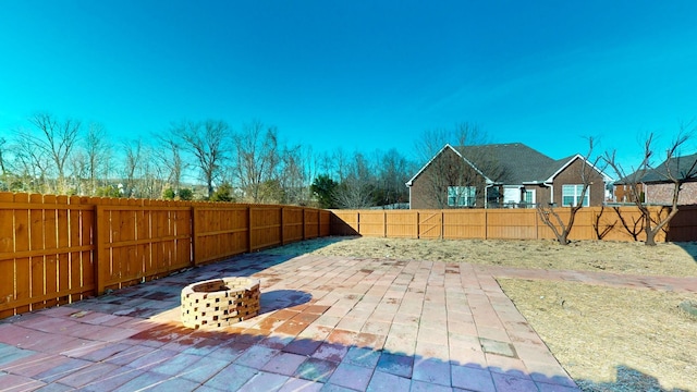 view of patio / terrace featuring a fire pit