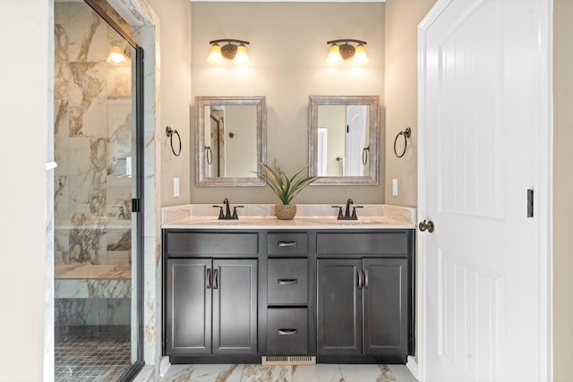 bathroom with a shower with door and vanity