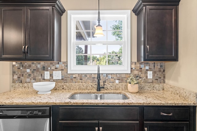 kitchen featuring sink, a wealth of natural light, hanging light fixtures, and dishwasher