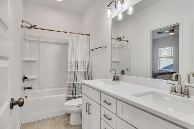 full bathroom with shower / tub combo, vanity, tile patterned floors, and toilet