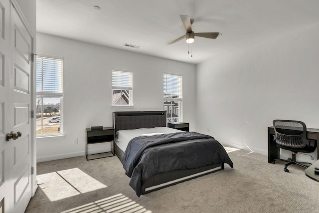 carpeted bedroom with ceiling fan