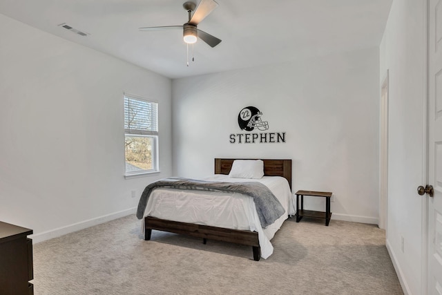 bedroom featuring ceiling fan and light colored carpet