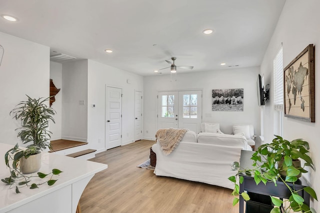 bedroom with light hardwood / wood-style floors, french doors, and ceiling fan