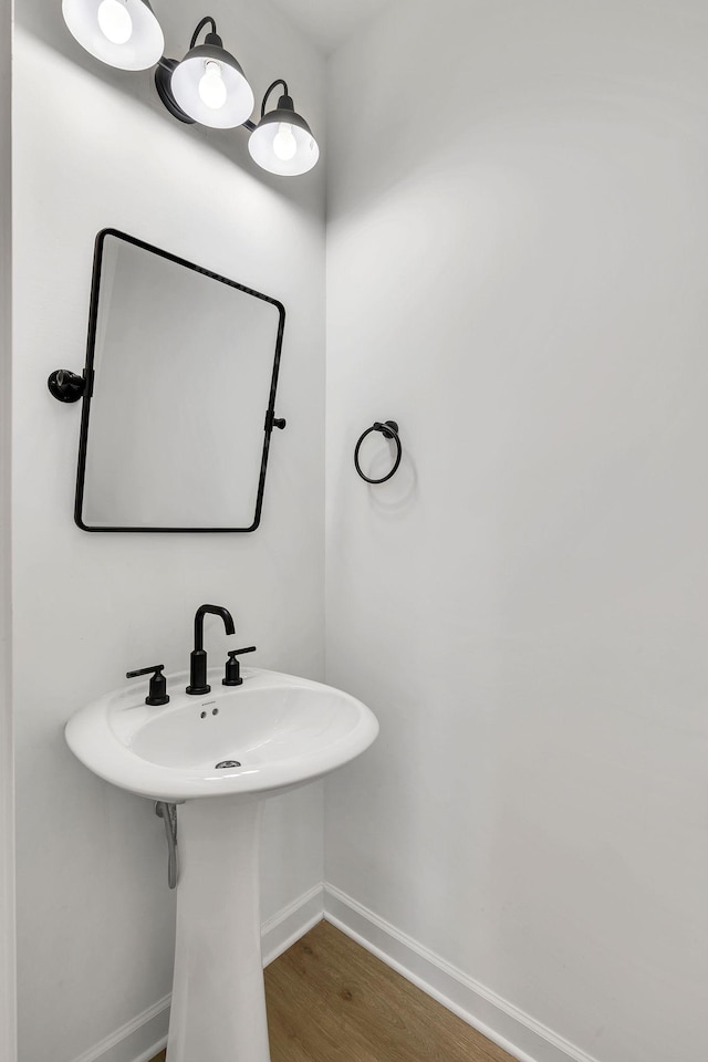 bathroom with wood-type flooring