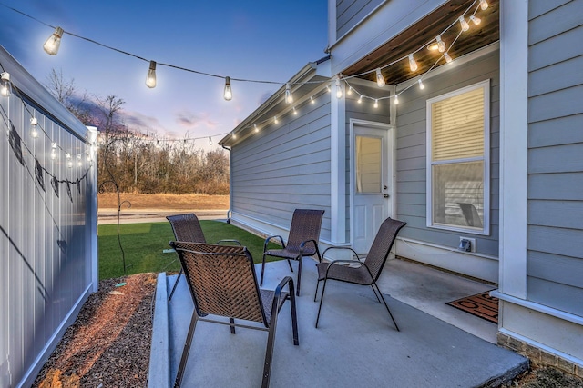 patio terrace at dusk with a yard