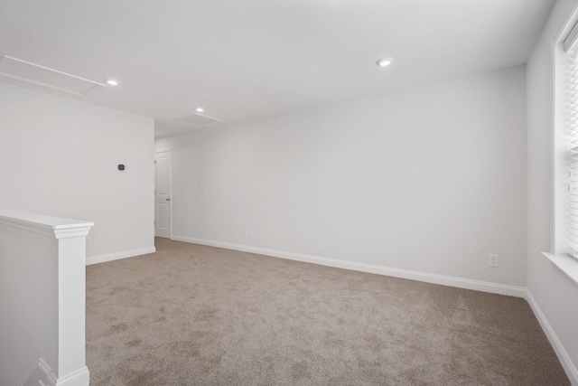 carpeted empty room with a wealth of natural light