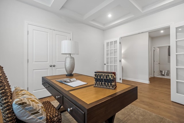 office space with beamed ceiling, coffered ceiling, and hardwood / wood-style floors