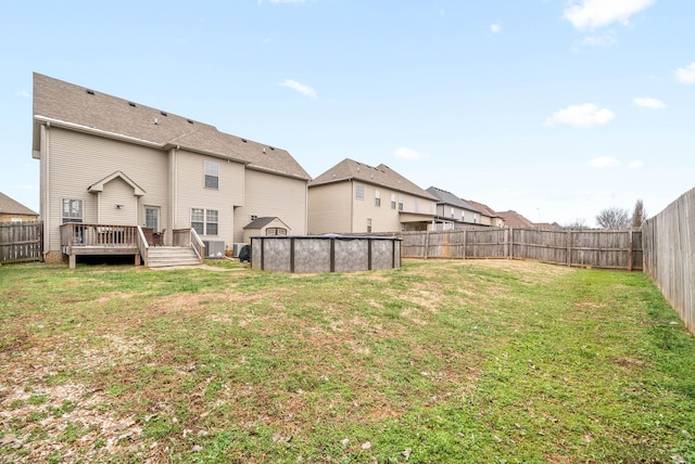 view of yard featuring a swimming pool side deck