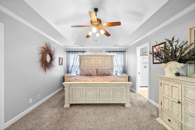 bedroom with ceiling fan, ornamental molding, a raised ceiling, and light carpet