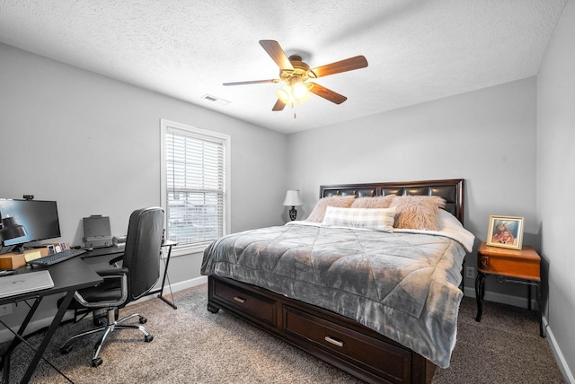 bedroom featuring carpet floors, a textured ceiling, and ceiling fan