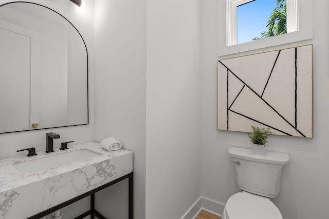 bathroom with sink and toilet