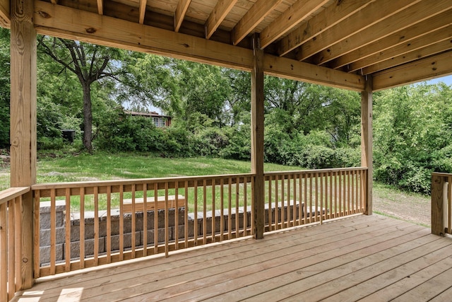 wooden deck with a yard