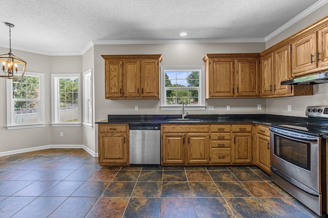 kitchen with pendant lighting, sink, plenty of natural light, and stainless steel appliances