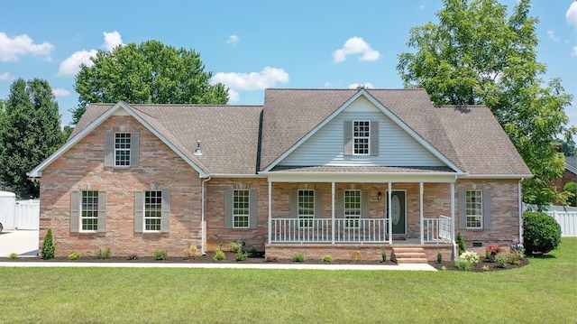 view of front of property with covered porch and a front yard