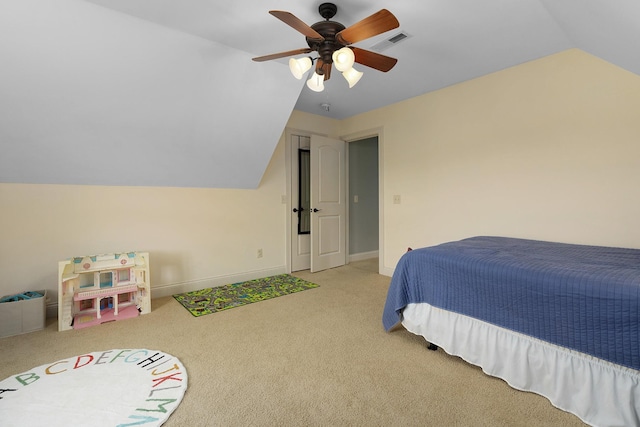 bedroom with lofted ceiling, light carpet, and ceiling fan