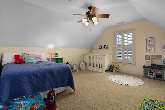 carpeted bedroom featuring ceiling fan and vaulted ceiling