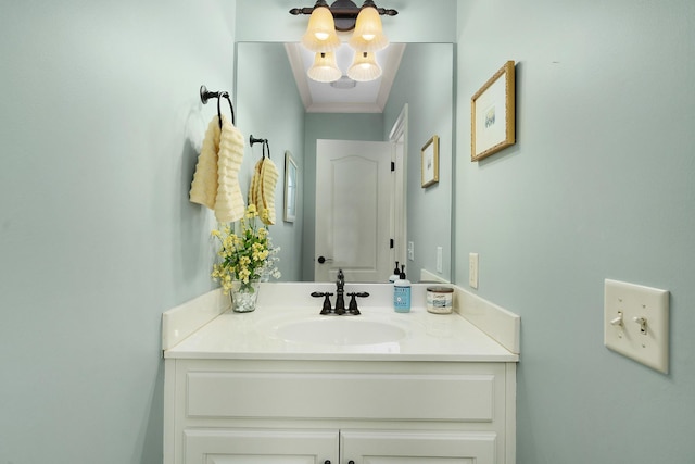 bathroom with vanity and ornamental molding