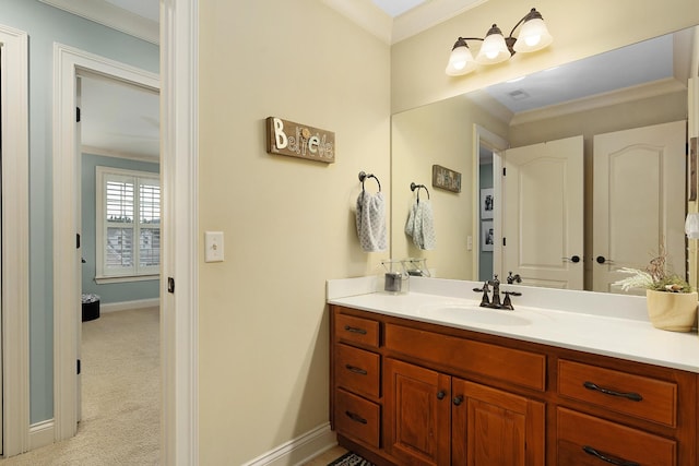 bathroom featuring vanity and ornamental molding