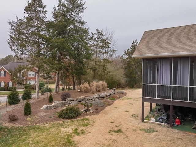 view of yard featuring a sunroom