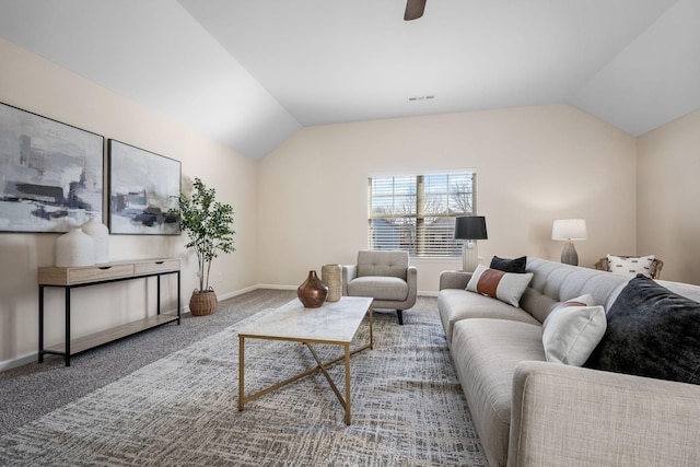 living room with lofted ceiling and carpet