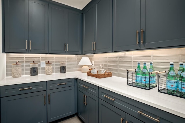 kitchen featuring gray cabinetry and backsplash