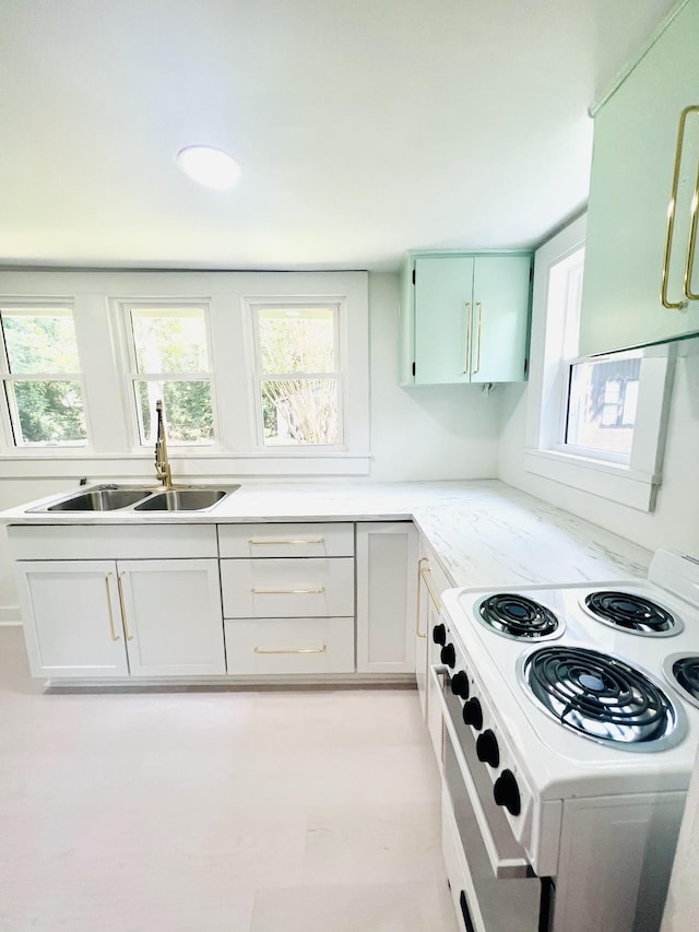 kitchen featuring sink and white electric range oven