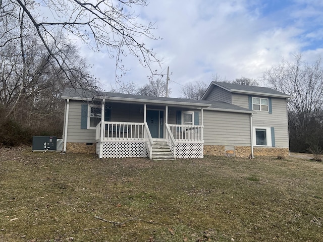 back of property featuring central AC, a porch, and a lawn