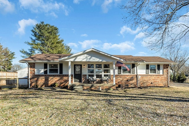 view of front of property with covered porch and a front lawn