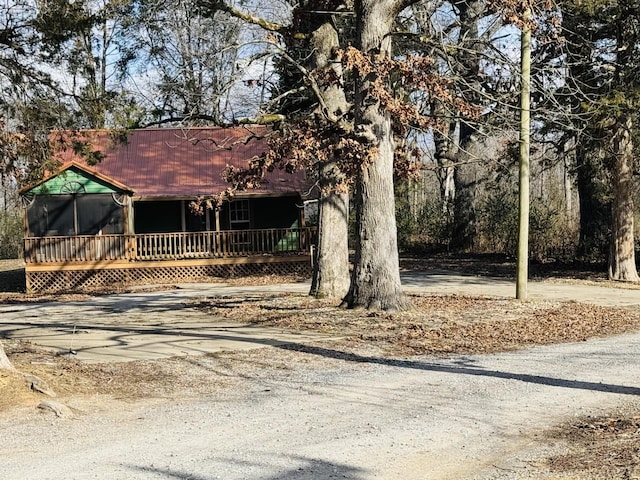 view of front of property featuring a wooden deck