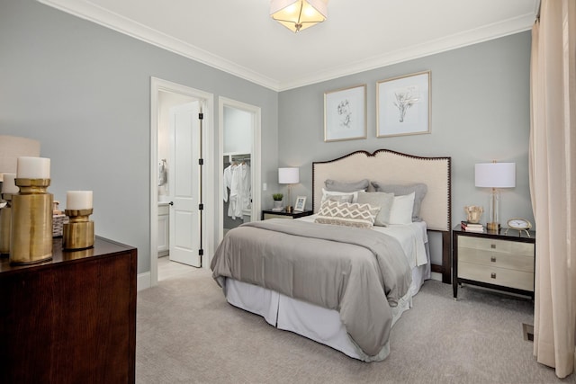 bedroom featuring ornamental molding, light carpet, and ensuite bath