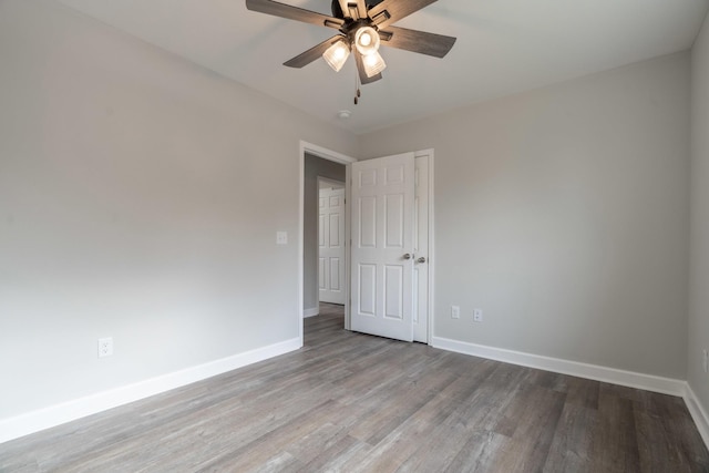 spare room featuring hardwood / wood-style flooring and ceiling fan