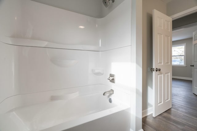 bathroom featuring shower / tub combination and wood-type flooring