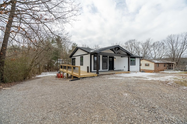 rear view of house with a wooden deck