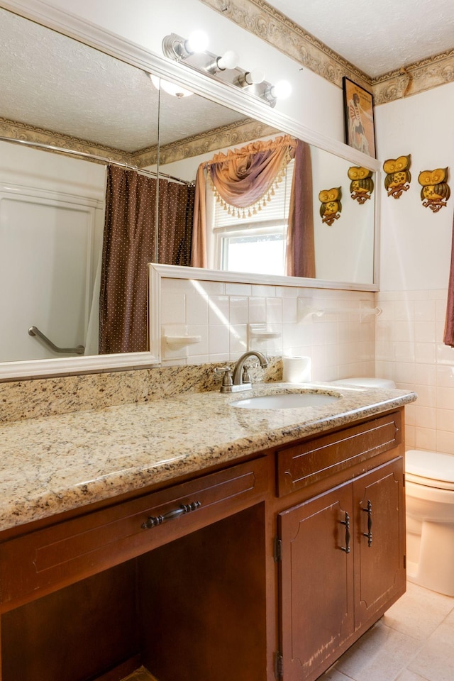 bathroom featuring tile walls, a shower with shower curtain, vanity, decorative backsplash, and toilet