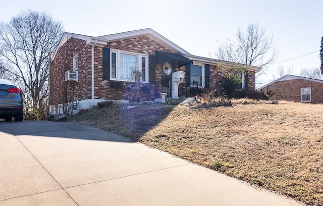 ranch-style house featuring cooling unit