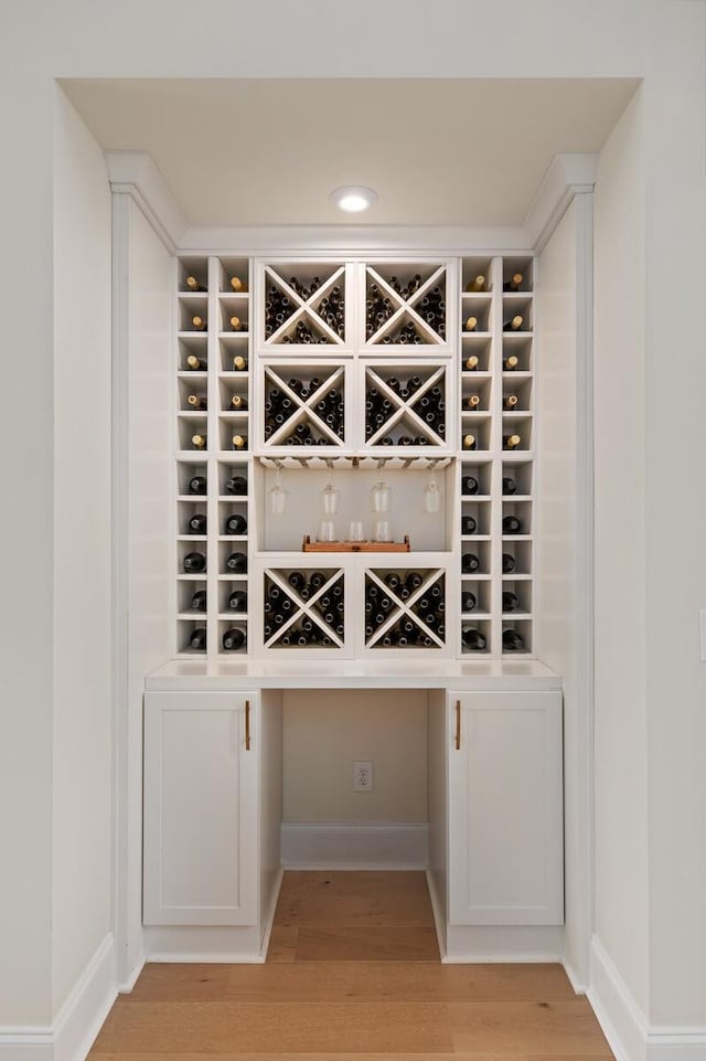 wine area featuring light wood-type flooring