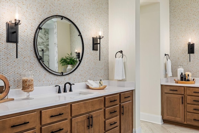 bathroom with tasteful backsplash and vanity