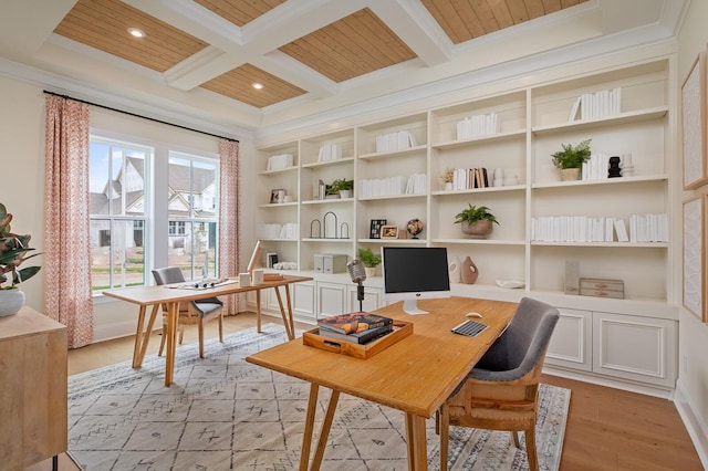 office space featuring crown molding, coffered ceiling, and beam ceiling