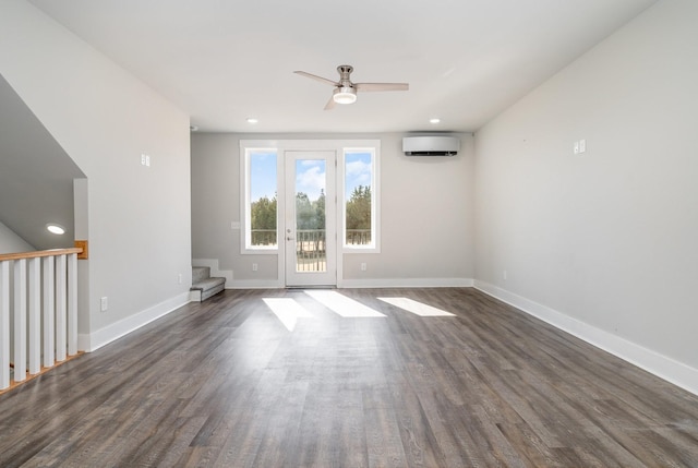 unfurnished room featuring ceiling fan, dark hardwood / wood-style floors, and a wall mounted AC