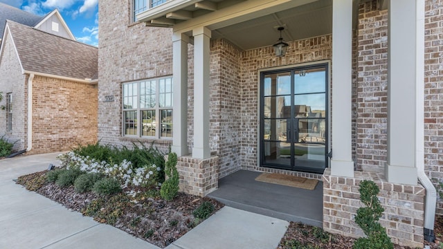 view of exterior entry featuring french doors