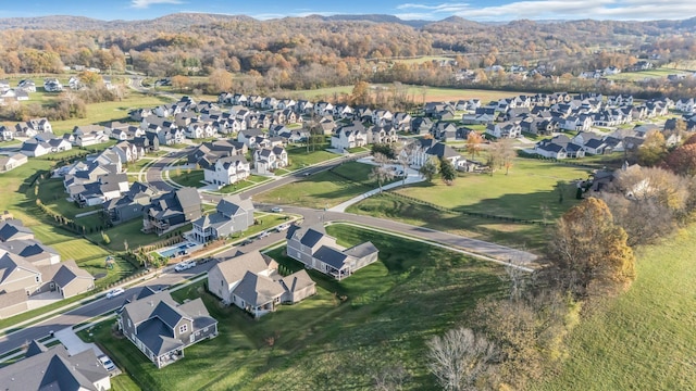 birds eye view of property with a mountain view