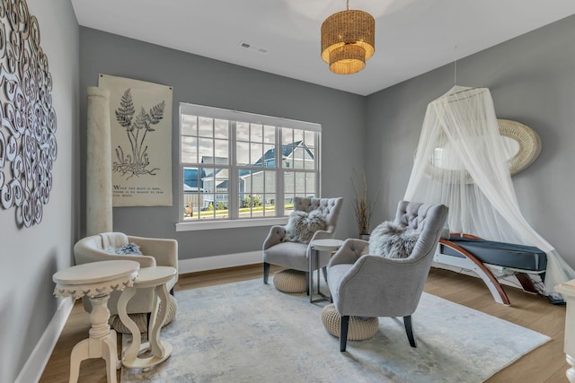 sitting room featuring hardwood / wood-style floors